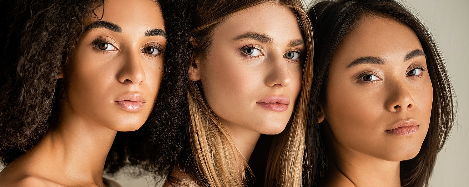 Three women with diverse hairstyles and features.