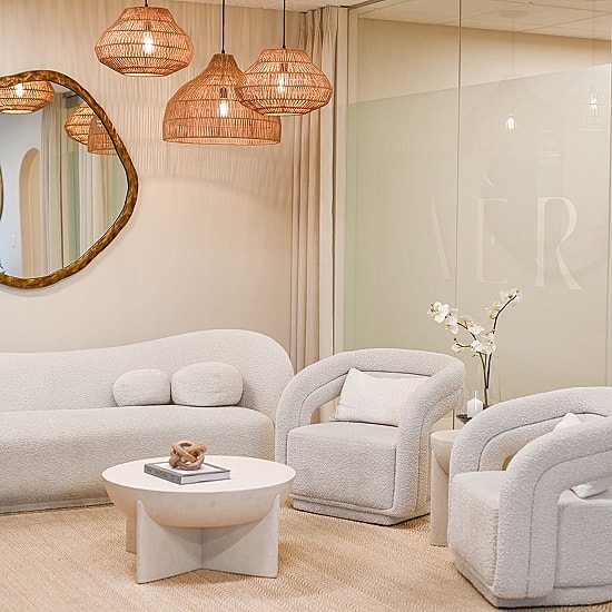 Modern minimalist seating area with pendant lights.