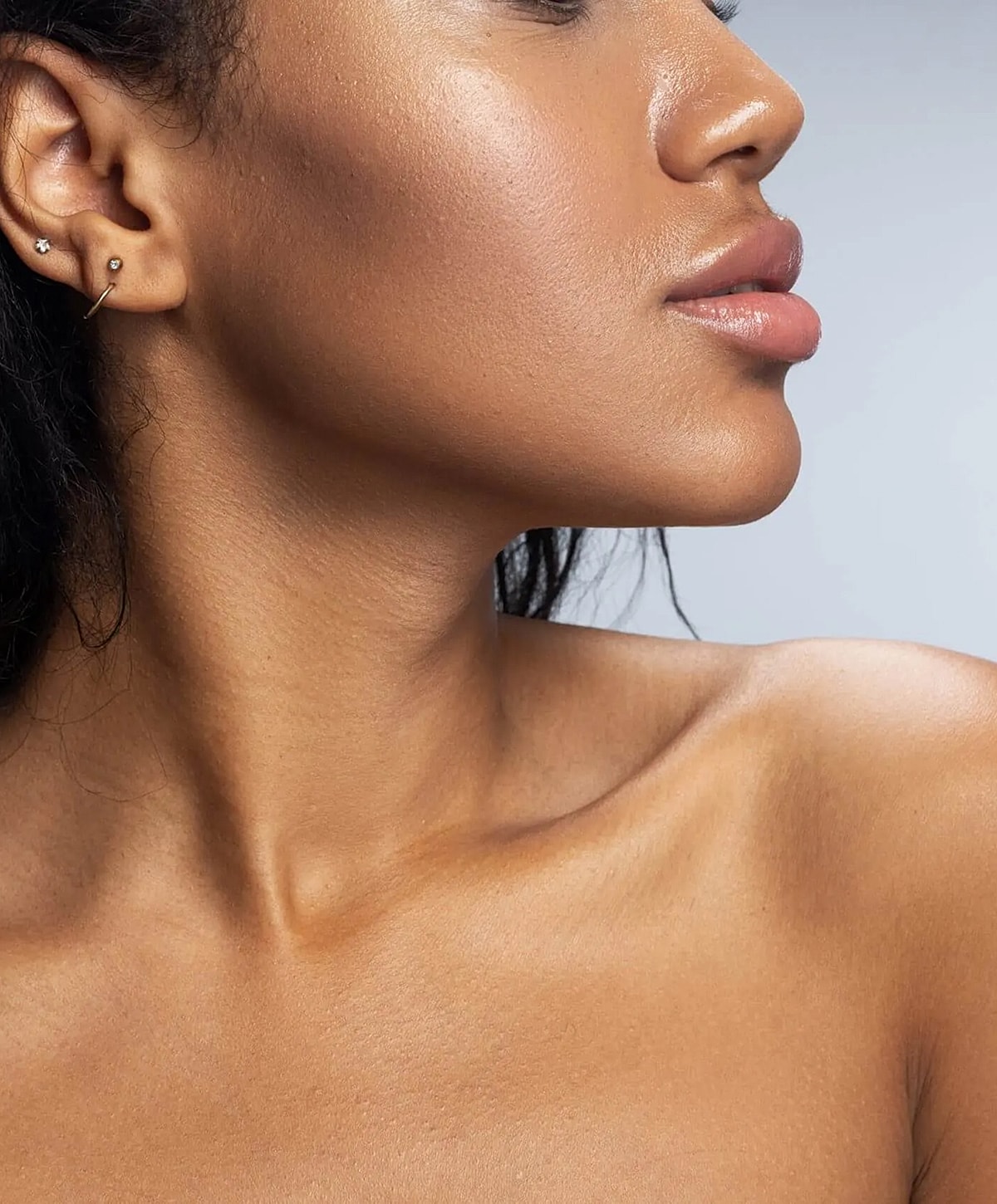 Side profile of a woman highlighting smooth skin.