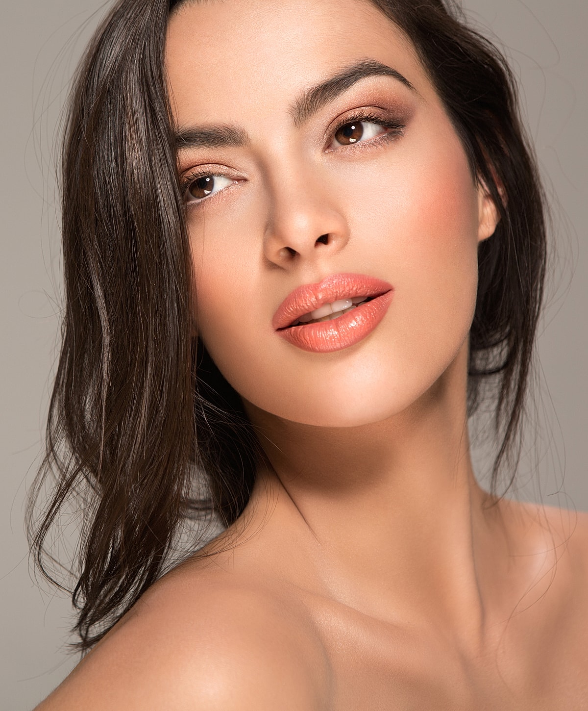 Close-up of a woman with soft makeup.