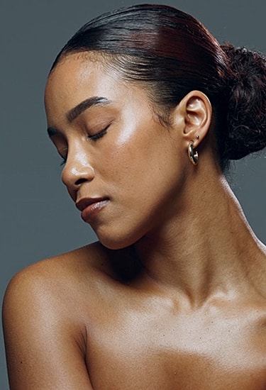 Woman with closed eyes, serene expression, natural beauty.