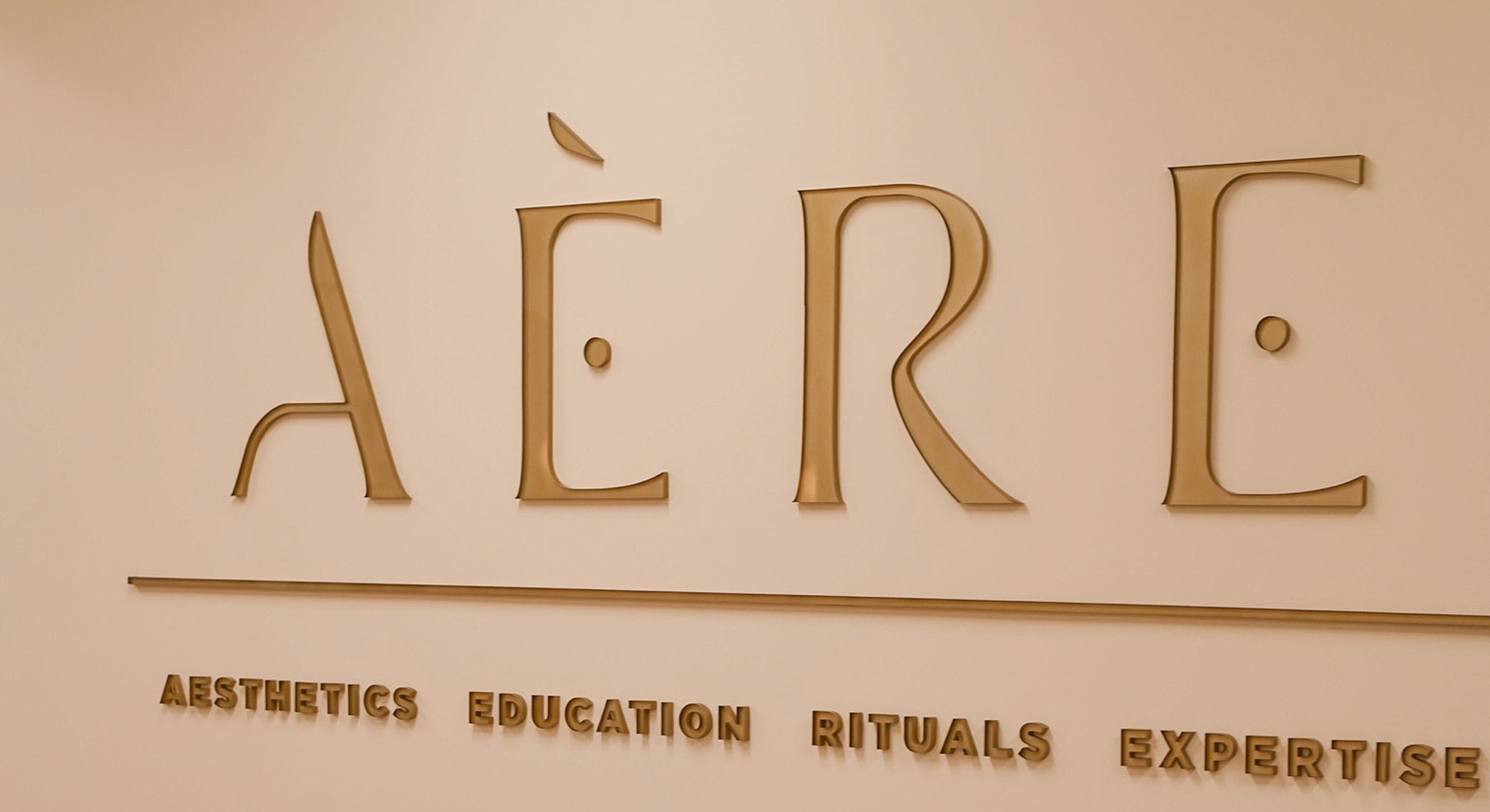 AER logo with aesthetic phrases beneath it