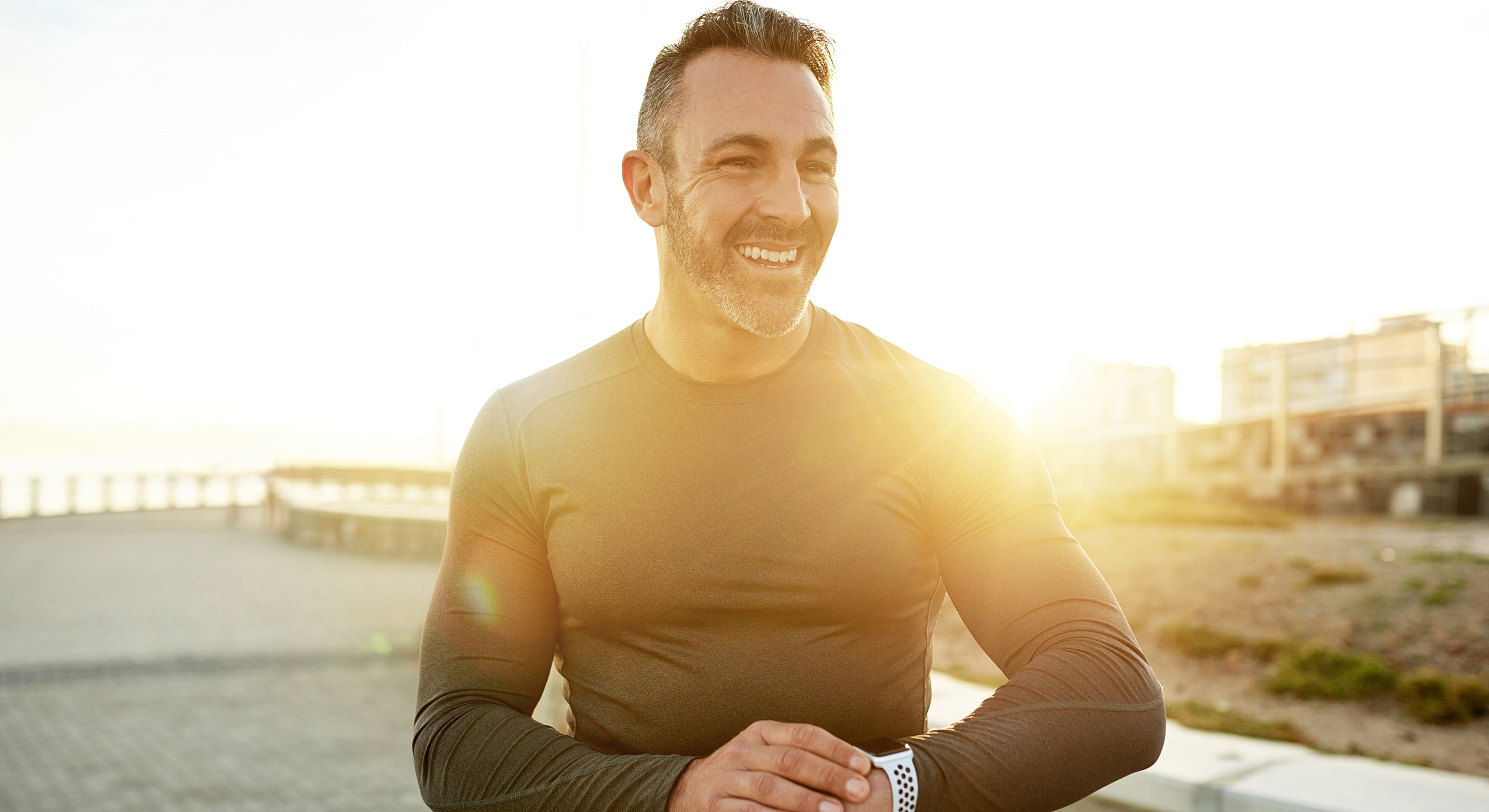 Smiling man enjoying outdoor fitness activity.